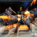 Daniel Ricciardo, McLaren MCL36, is pushed back into the garage