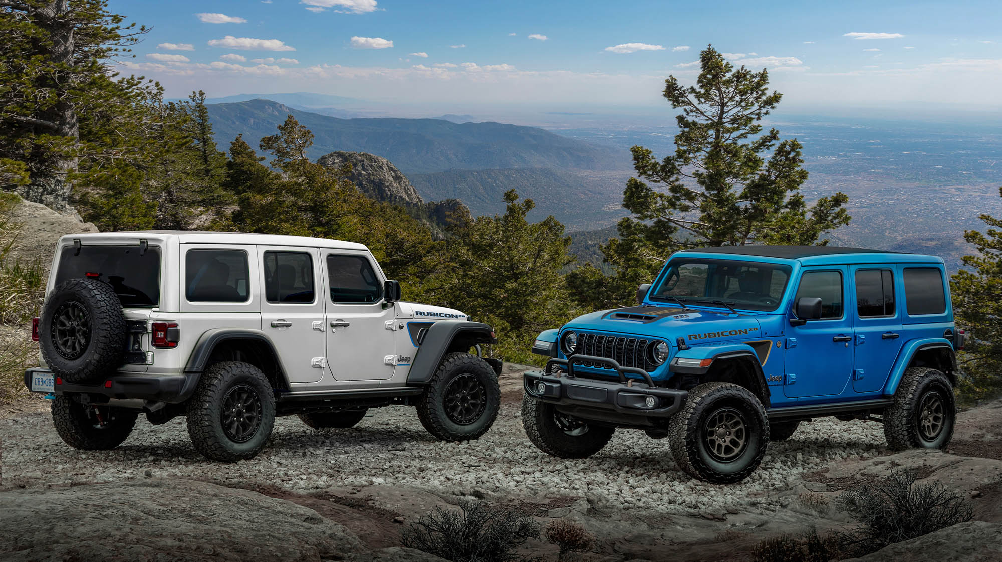 Rubicon 20th Anniversary editions: 2023 Jeep® Wrangler Rubicon 4xe (left, shown with optional Hinge-Gate Reinforcement by Mopar) and 2023 Jeep Wrangler Rubicon 392