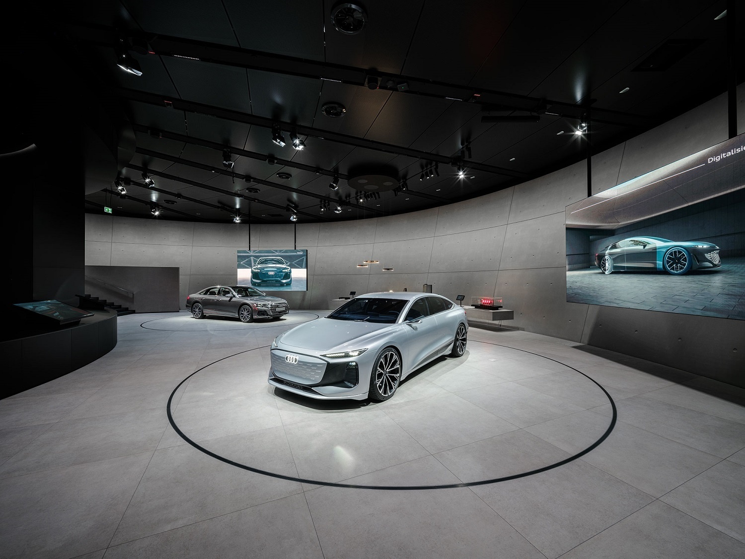 The Audi A6 e-tron concept and the plug-in hybrid Audi A8 60 TFSI e together with exhibits on an elongated lowboard bring the themes of digitization and design to life.