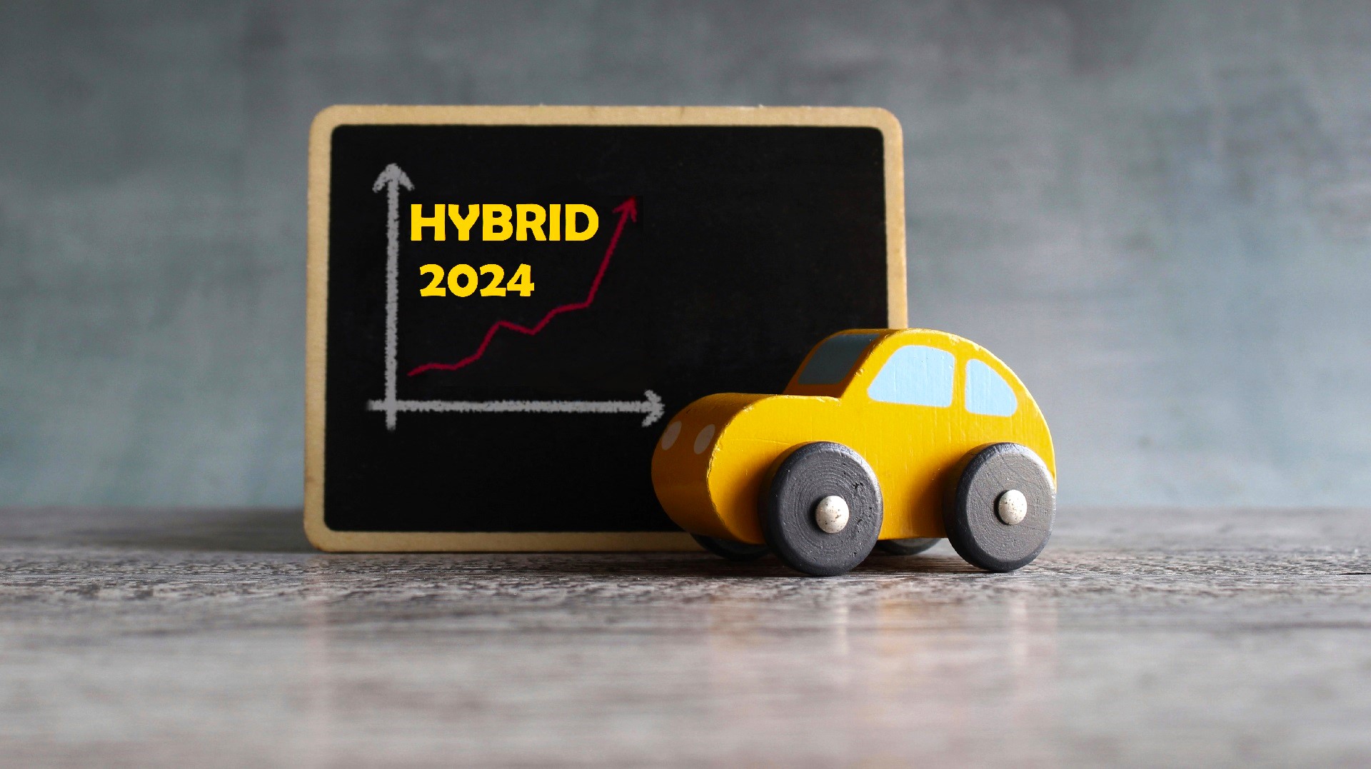 Toy car and chalkboard with downward arrow graph. Car rental dealer decrease lost sales concept.