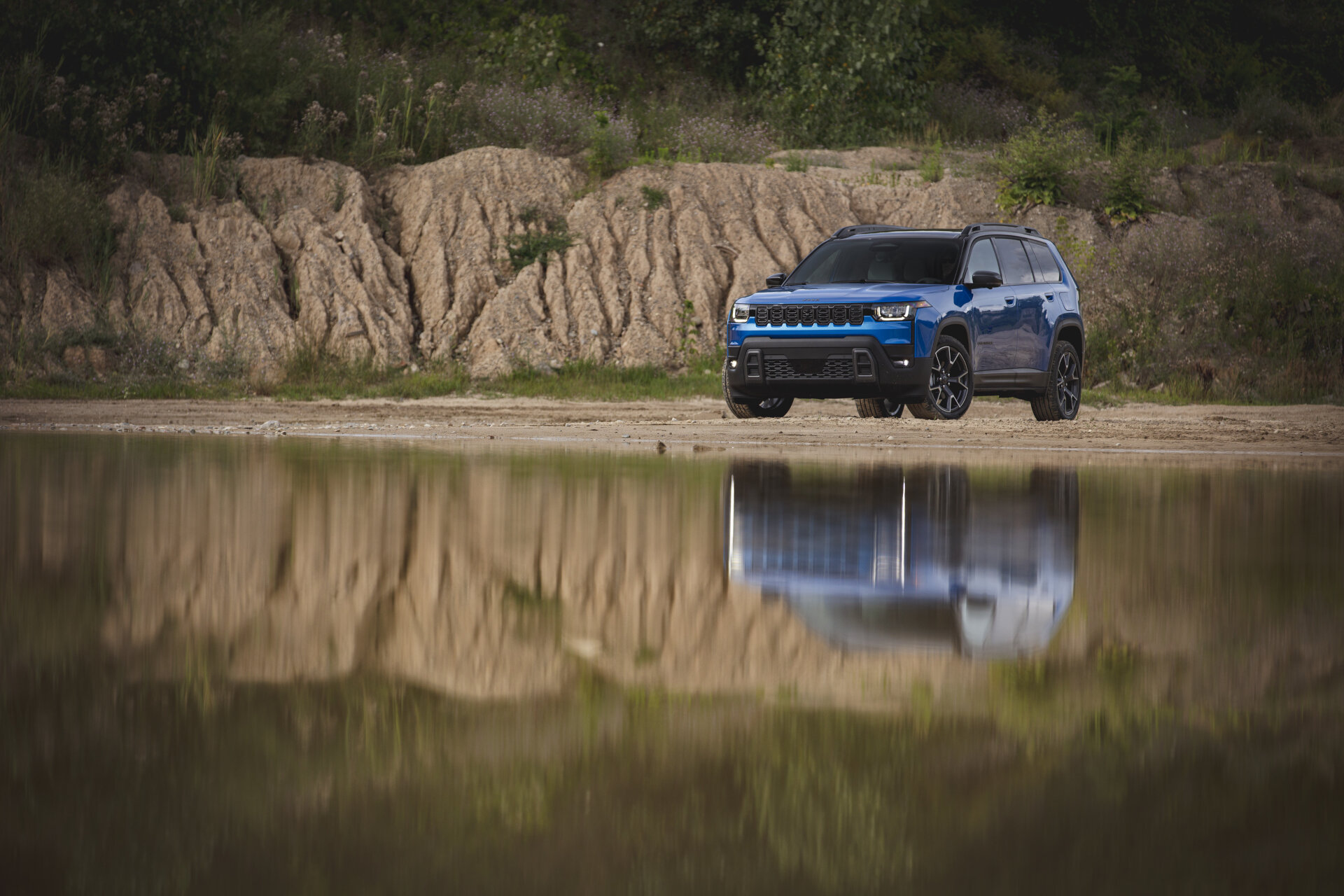 2026 Jeep® Cherokee in front of reflecting water 2026 Jeep® Cherokee in front of reflecting water
