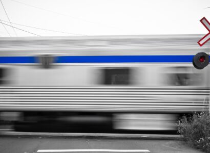 express train blurs past a railroad crossing sign 2026 03 09 06 08 46 utc
