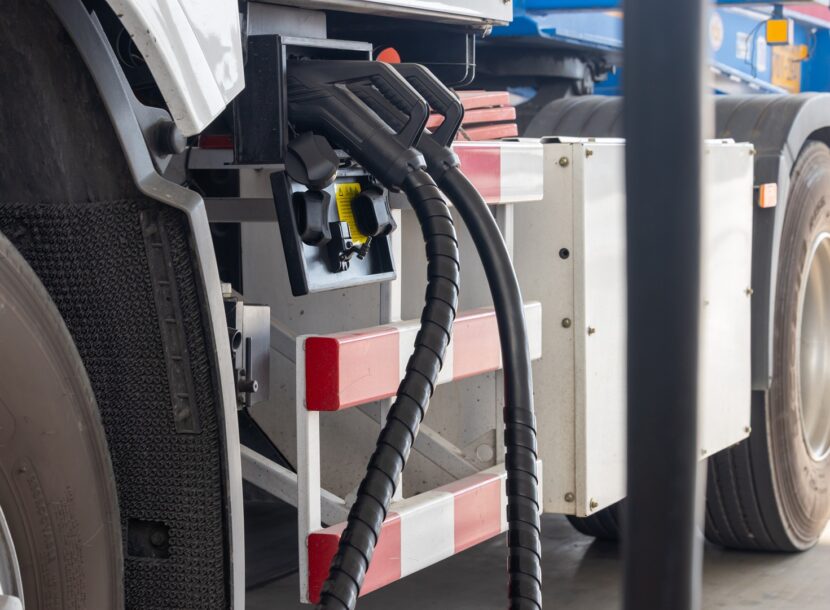 envato electric truck charging with black cables in charg 2026 03 08 00 50 10 utc