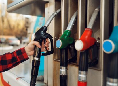 hand holding gas pump nozzle at gas station 2026 03 16 01 13 46 utc