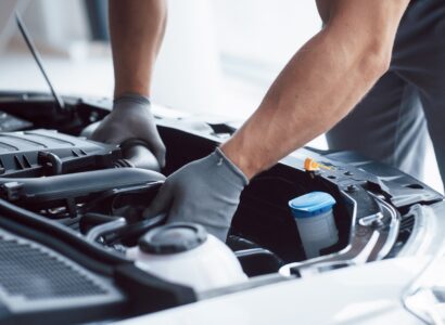 envato car mechanic inspecting engine bay at auto repair 2026 09 22 03 07 13 utc